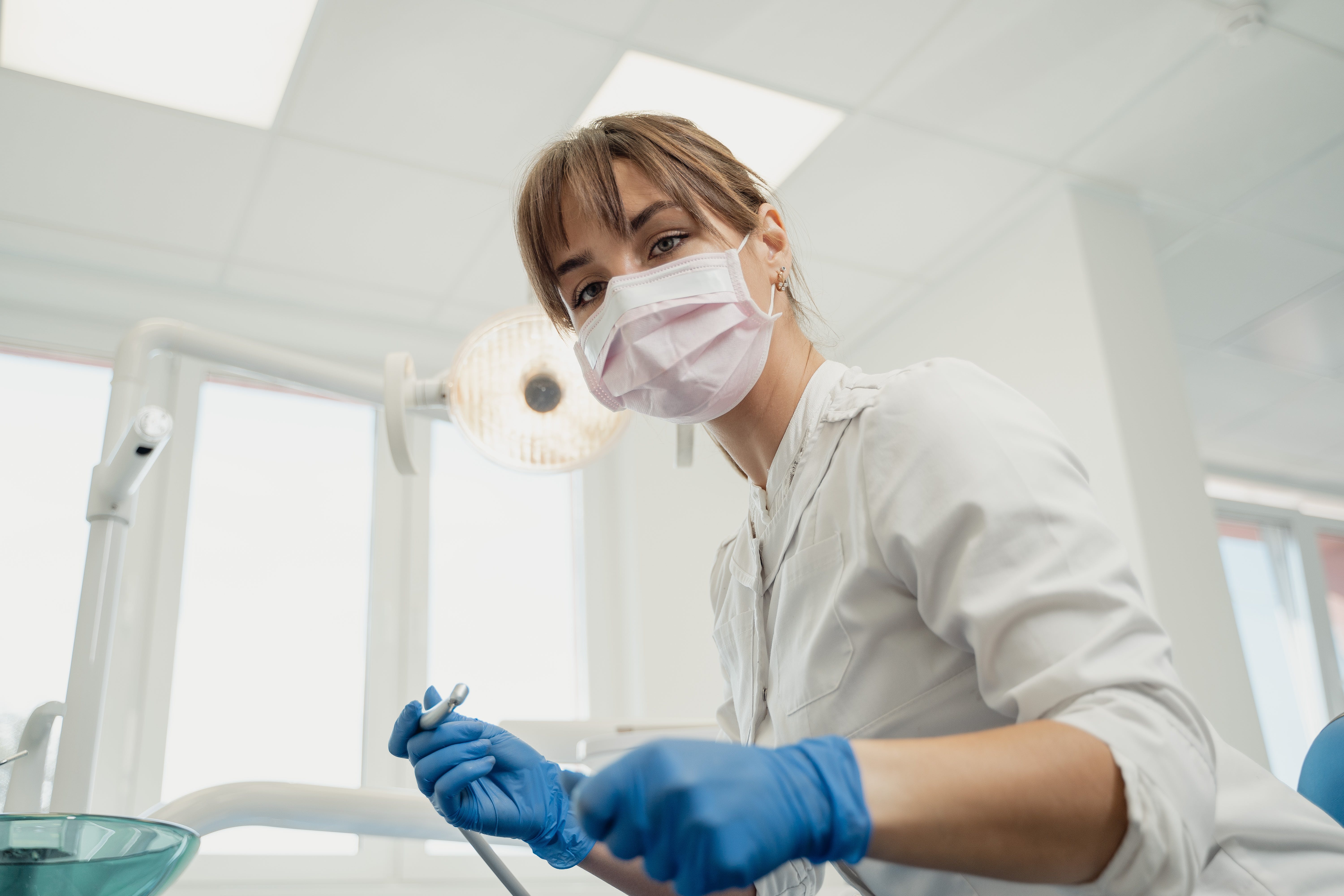 a dentist examining a patient