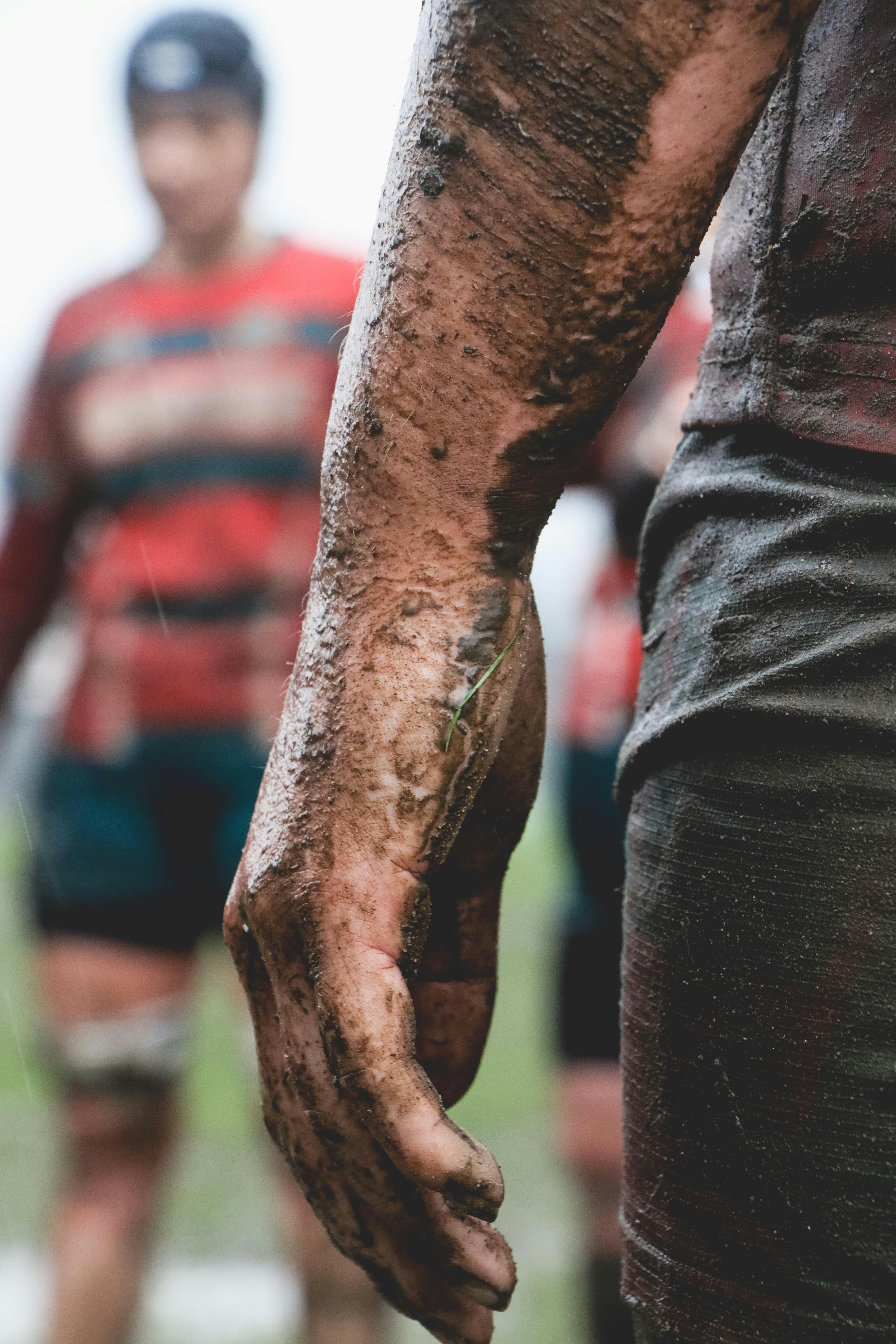 A close up of a person holding the hand of another person