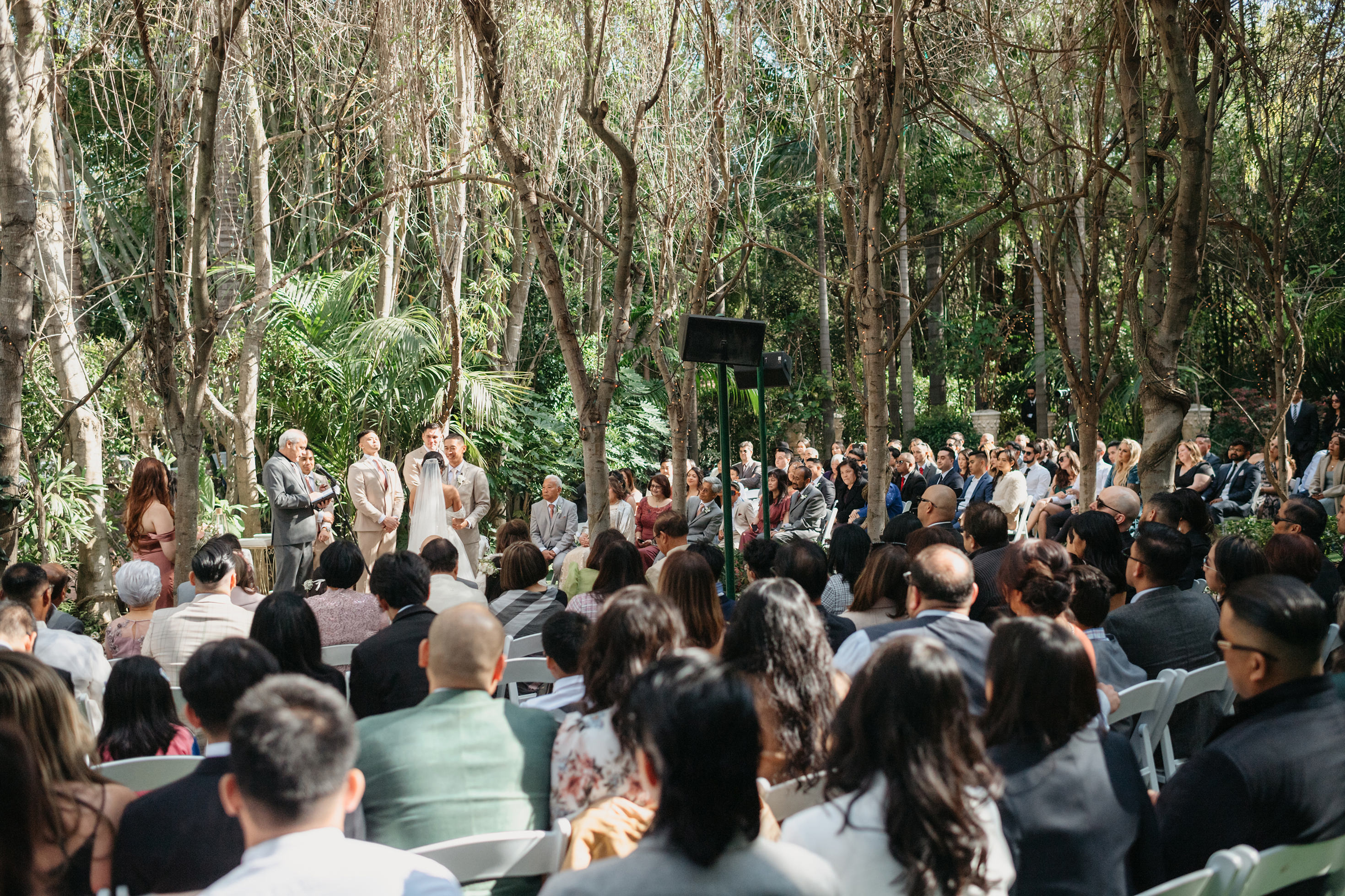 Flat lay wedding details with bouquet, rings, and sparkling bridal heels