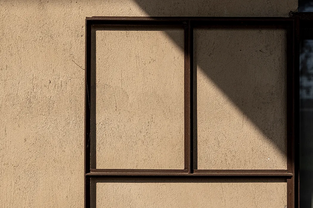 A table is set for a meal by the window.