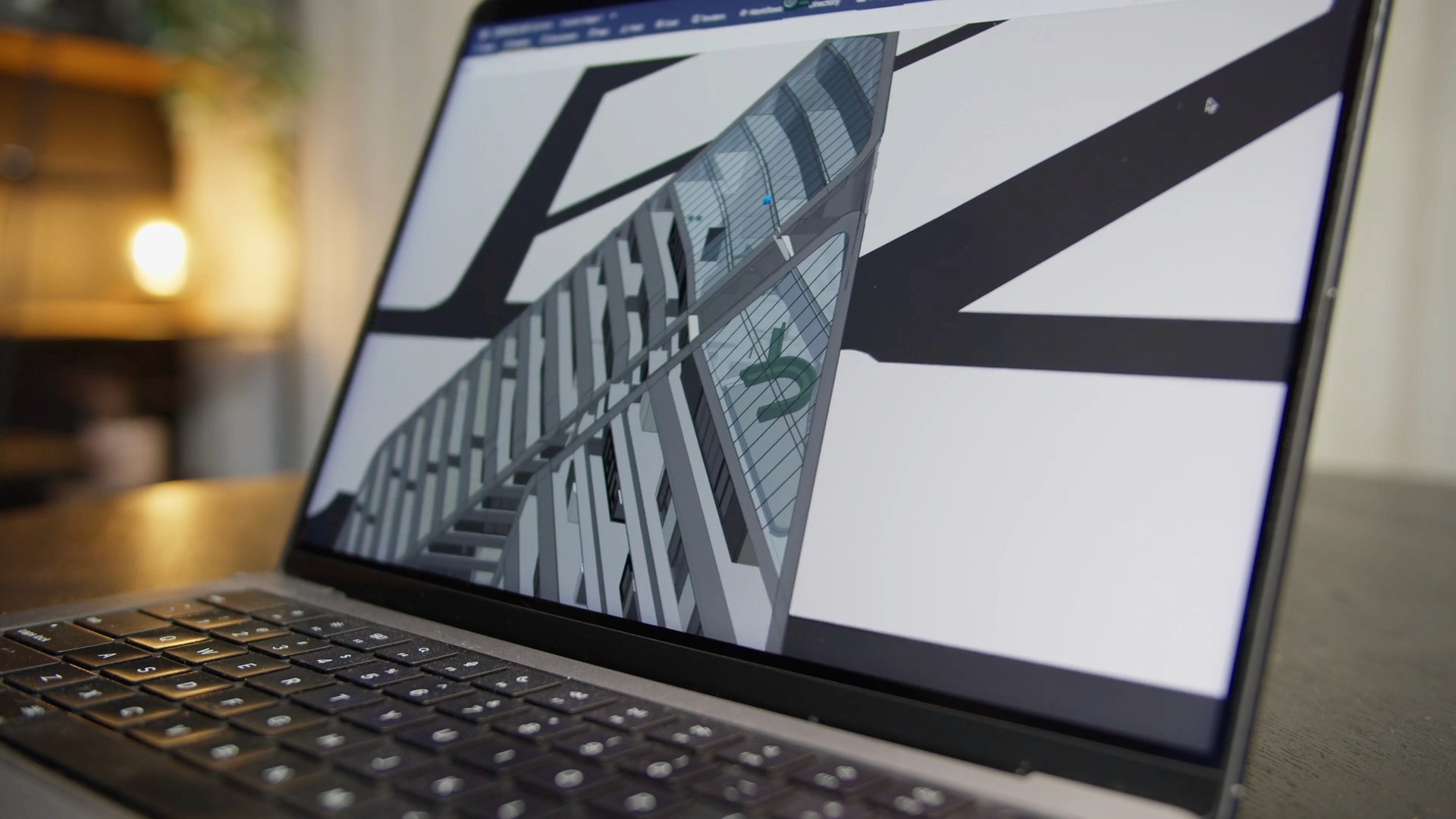 A close-up of a laptop screen displaying an architectural sketch
