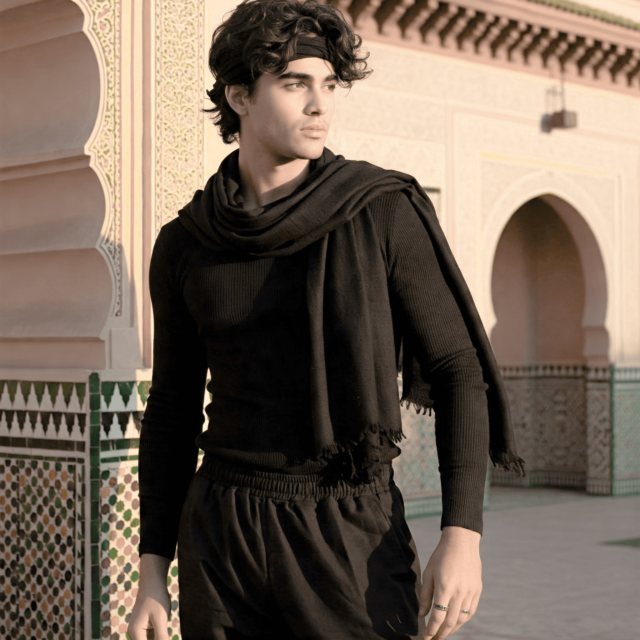 DUNZ photoshoot by Mehdi Meliani, male model with black scarf, modern fashion styling, studio/editorial lighting, minimalist aesthetic