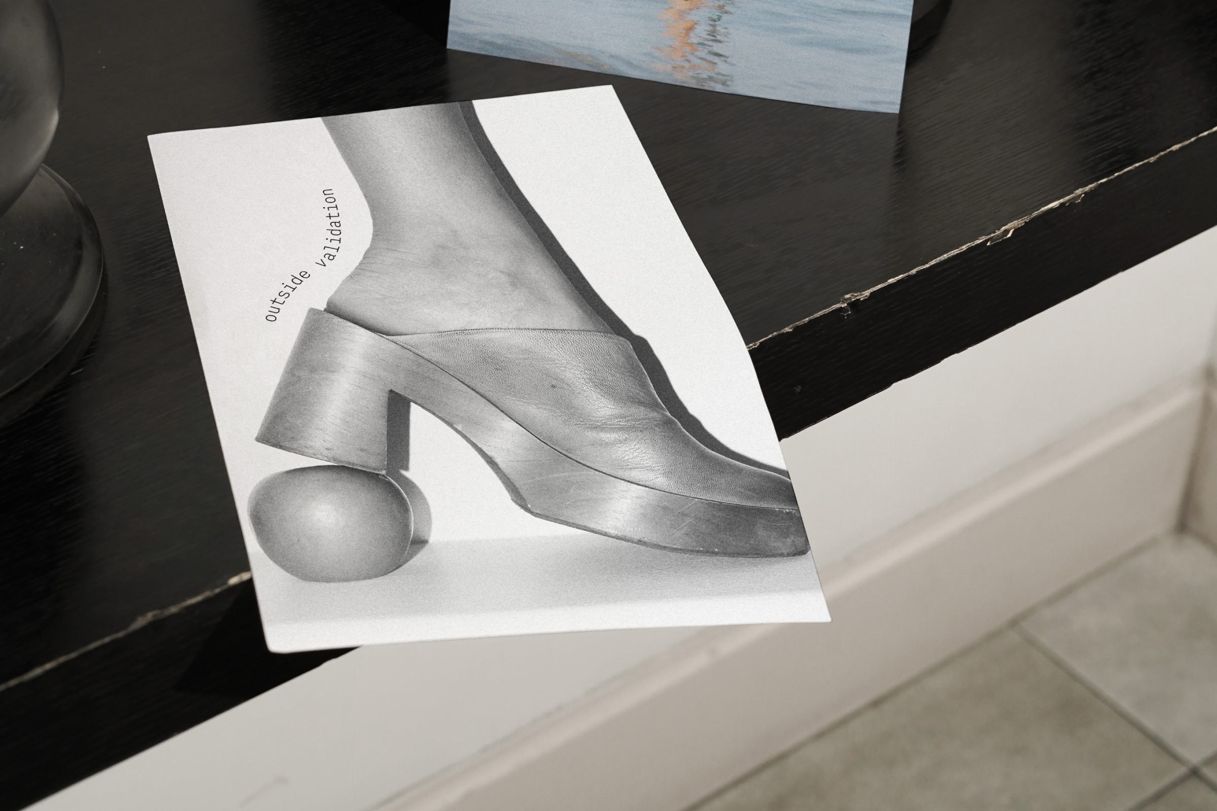 Close-up of a minimalist print featuring an abstract shoe illustration, symbolizing stylish and sophisticated design aesthetics.