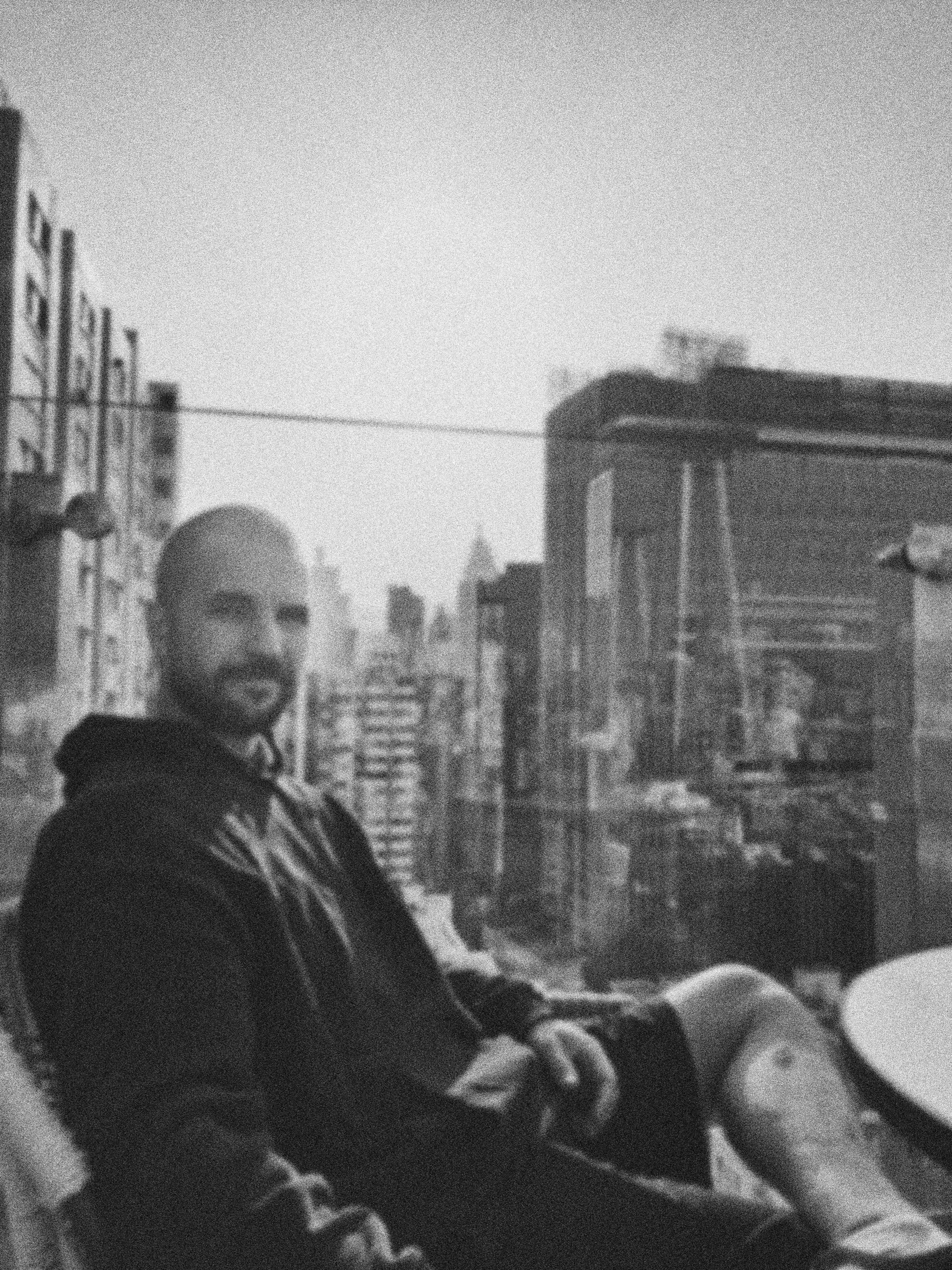 a blurry photo of a person standing in front of a wall