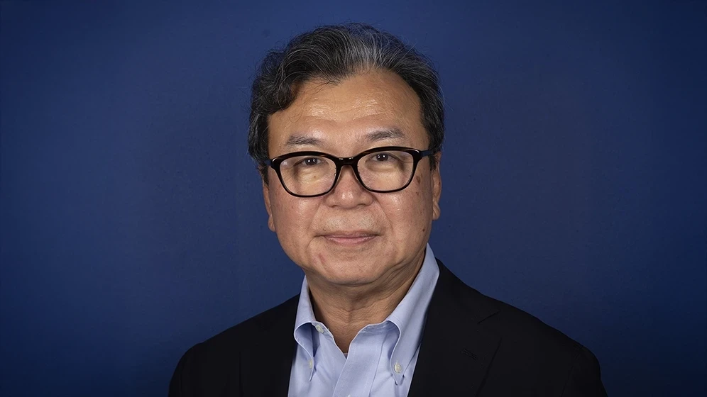 man in white crew neck shirt wearing black framed eyeglasses