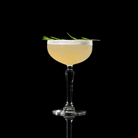 A closeup of a Nellie Bly drink against a dark background.
