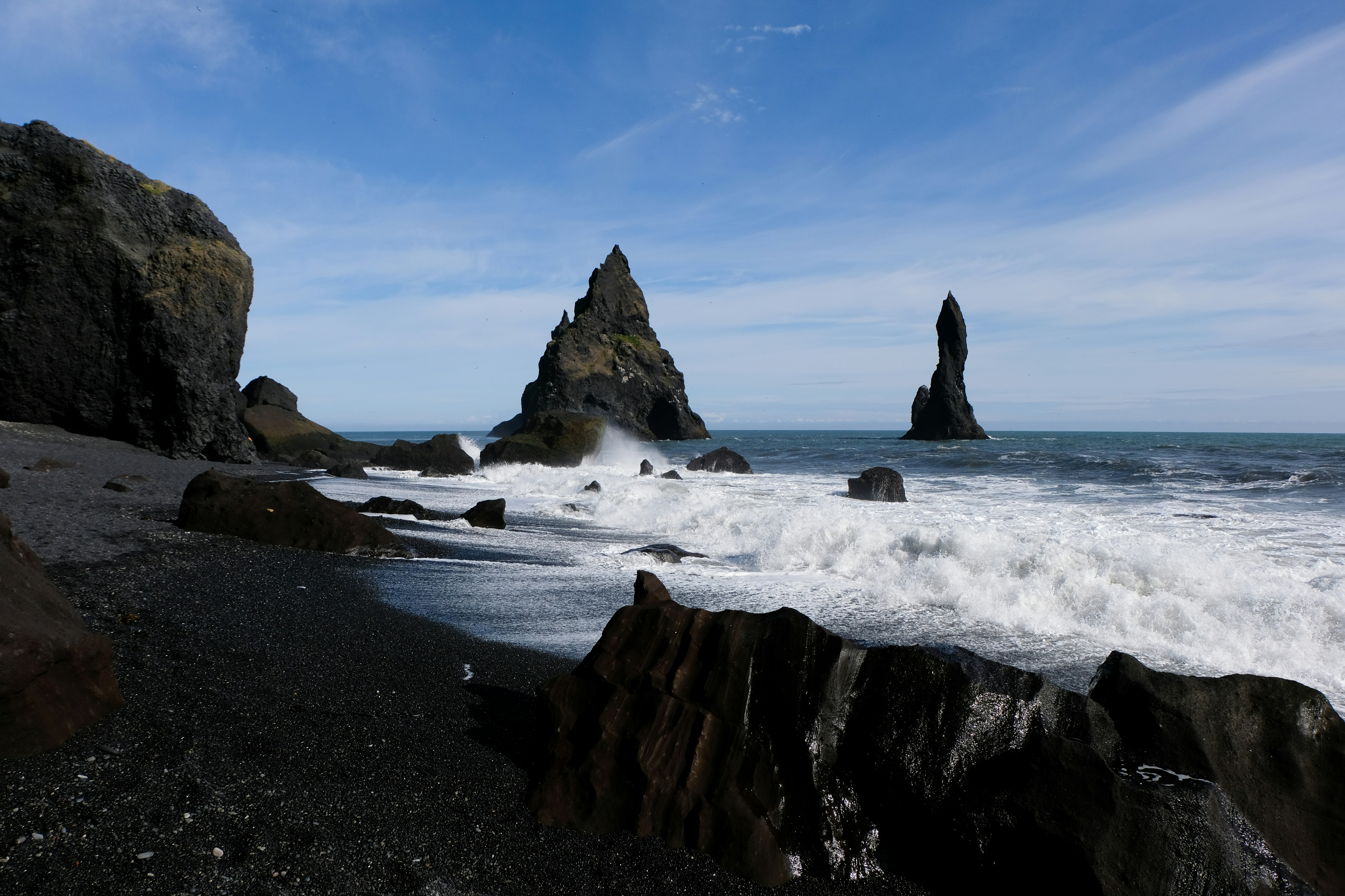 Sneaker waves crashing at Reynisfjara Black Sand Beach in Iceland.