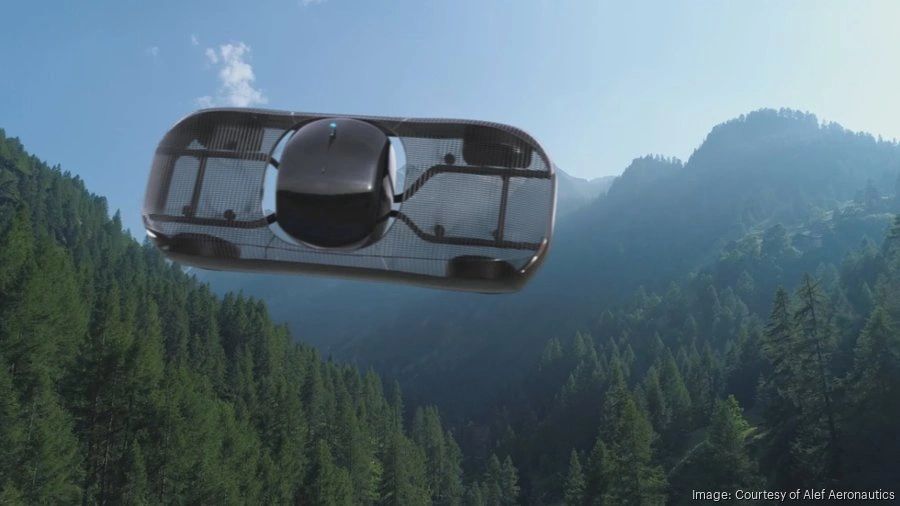 a black and white living room with a large tv