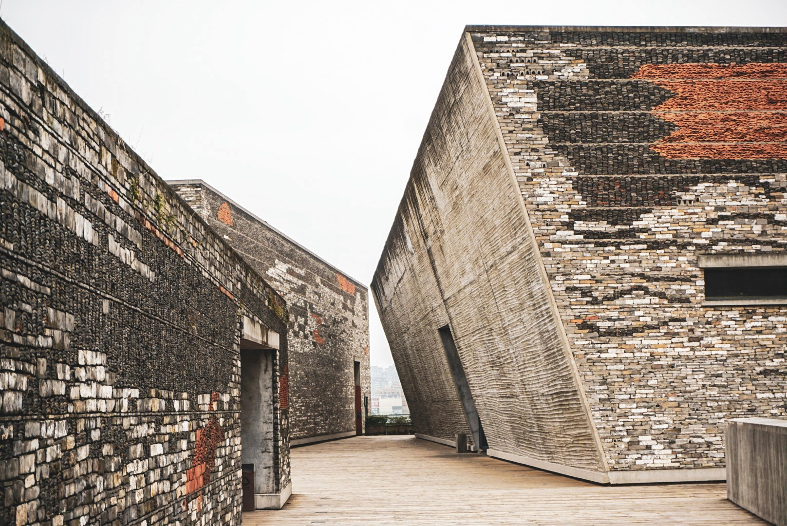 Contemporary concrete and brick architecture design for the NingBo Museum with angular walls in Ningbo, China, photographed by Janice Chen.
