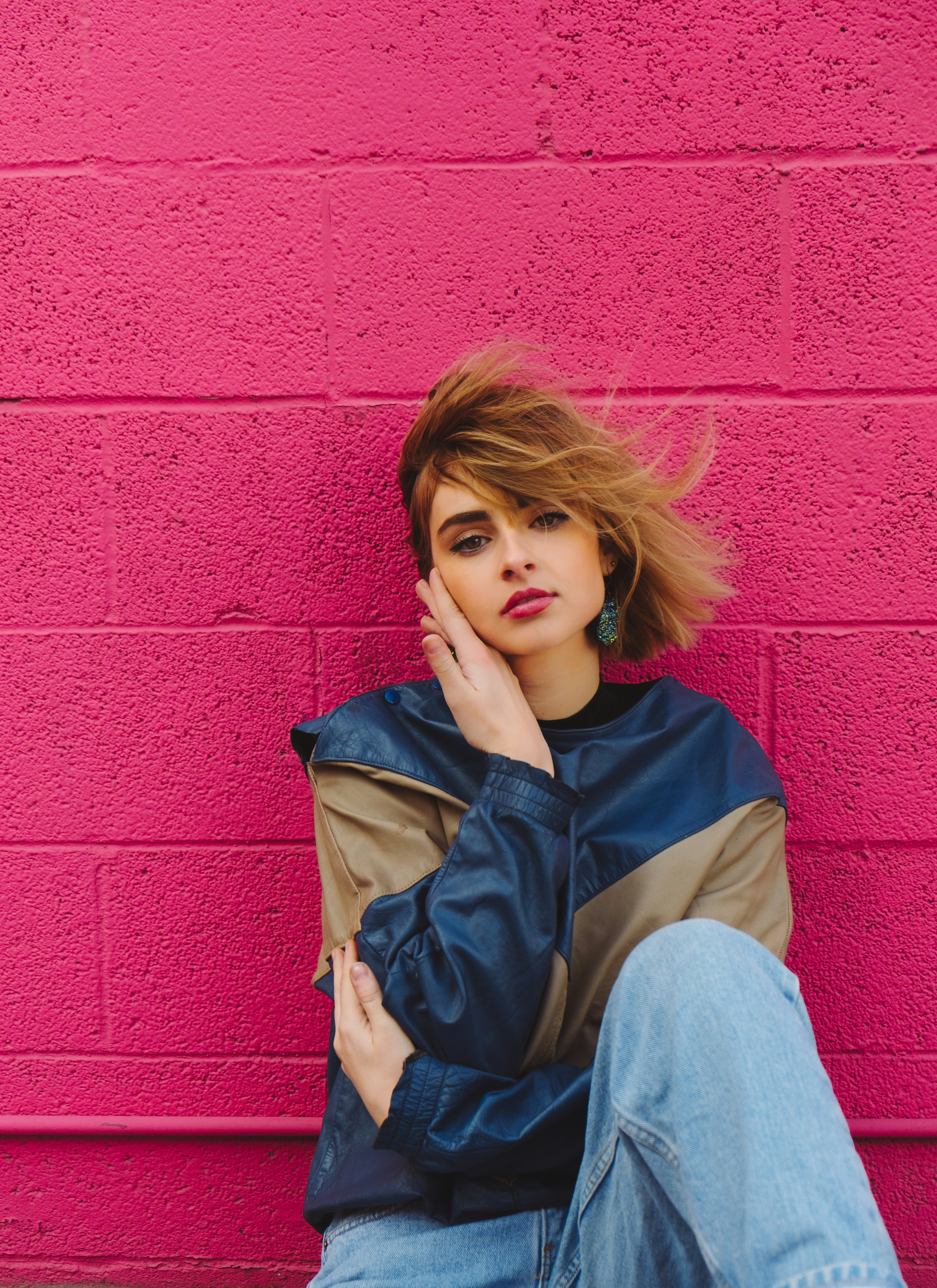 shallow focus photo of woman in navy-blue and brown jacket