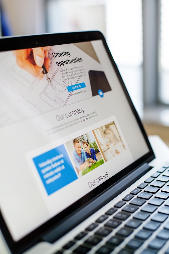 a laptop displaying a website 