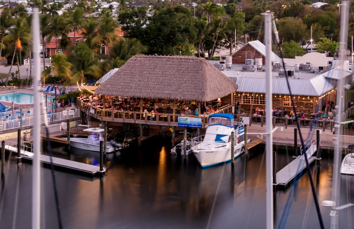 Skipper’s Dockside waterfront restaurant and marina at dusk.