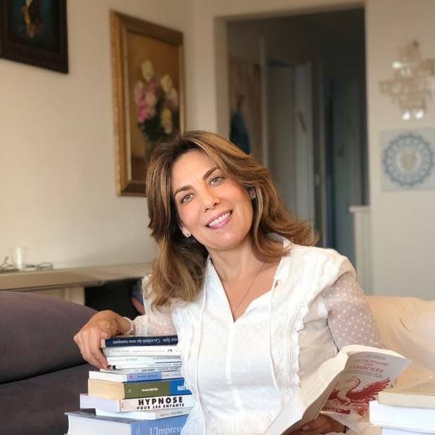 man smiling while sitting on floor during daytime