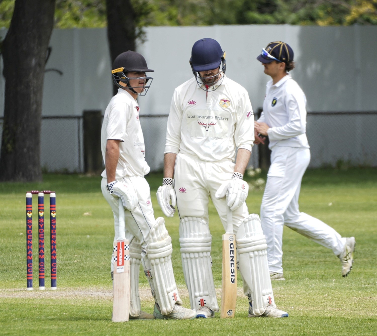 man in black jacket holding yellow and green plastic bottle