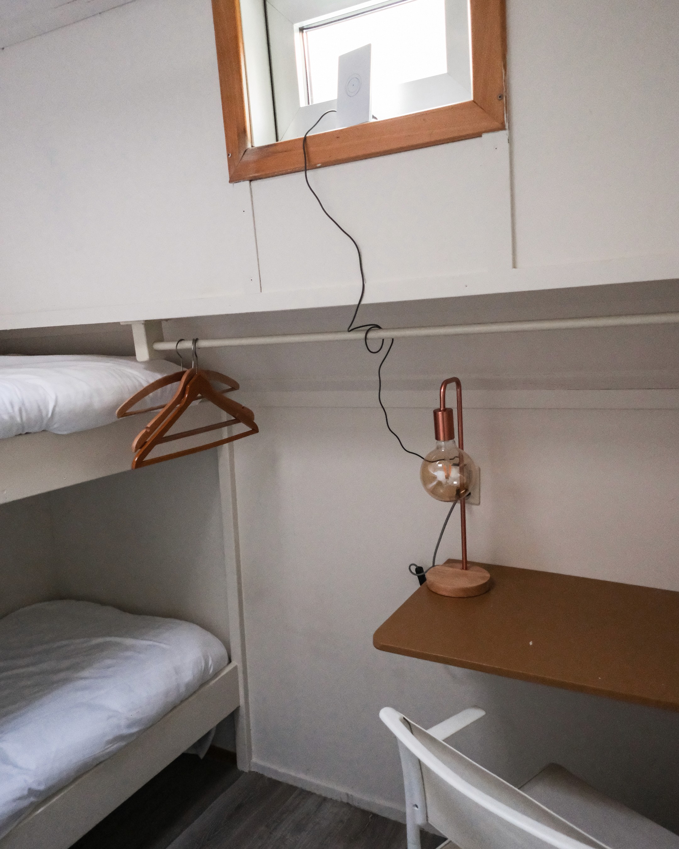 Classic bedroom with canopy bed and patterned pillows