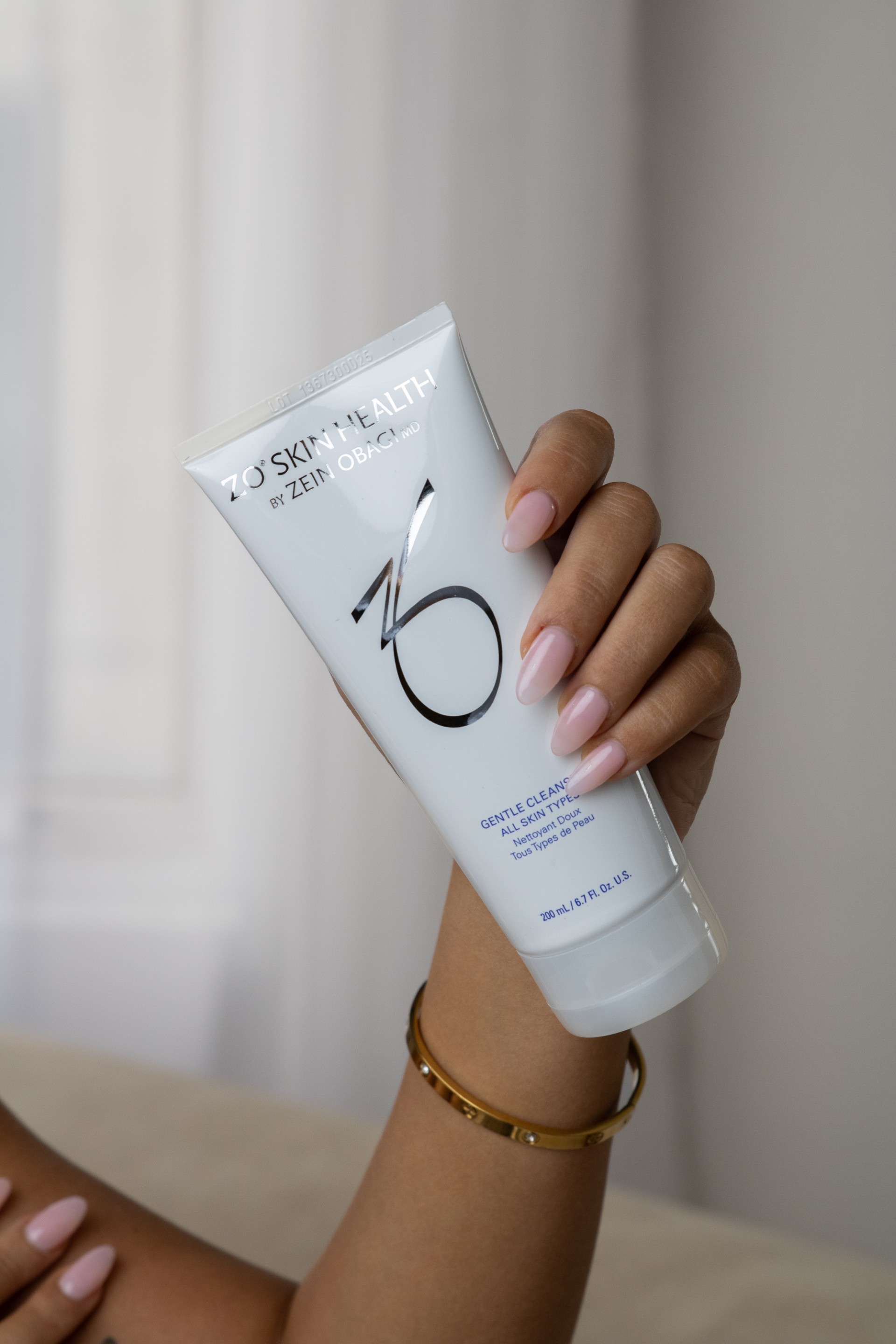 A living room with two white chairs and a coffee table