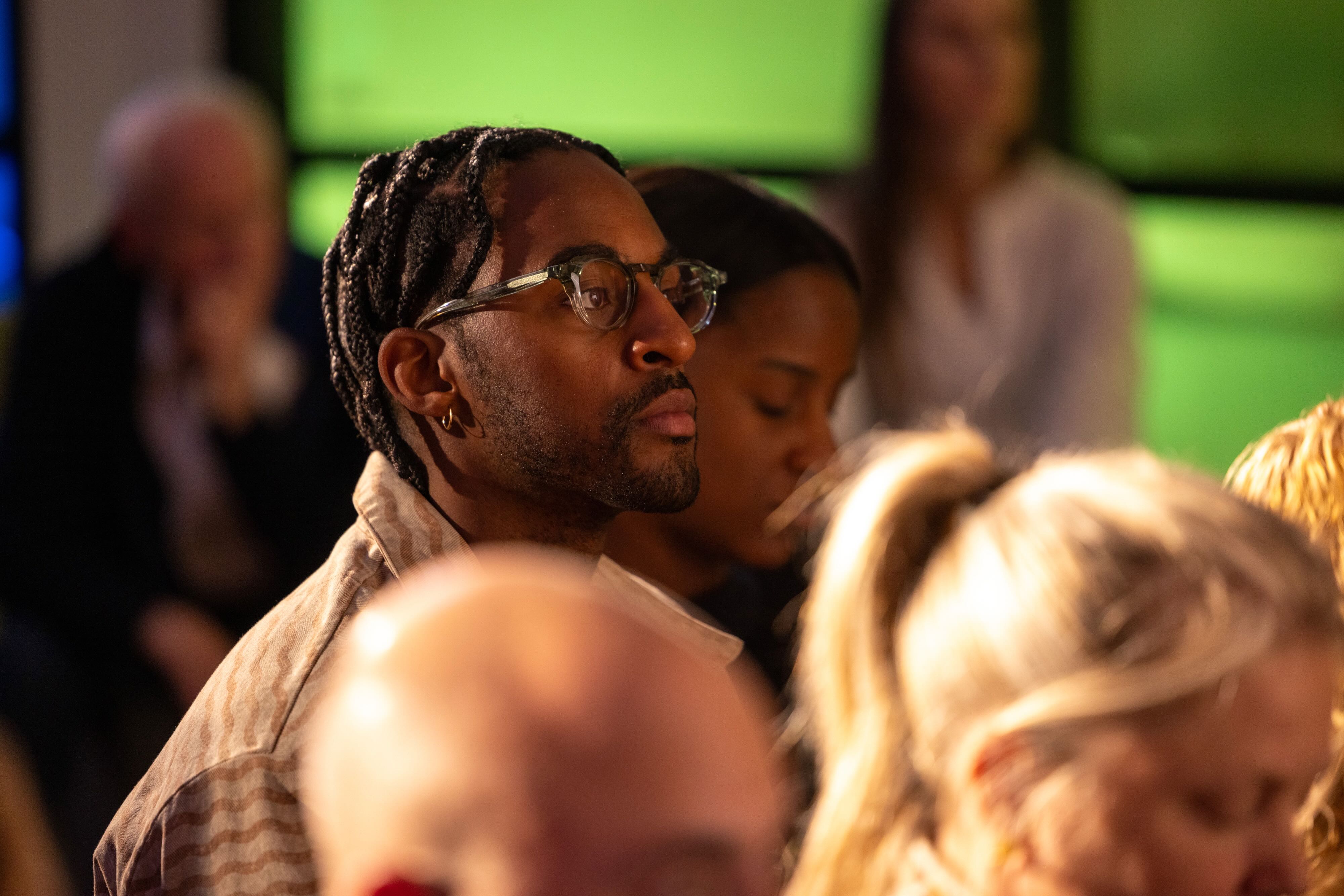 A person listening intently to a talk at the Artificiality Summit