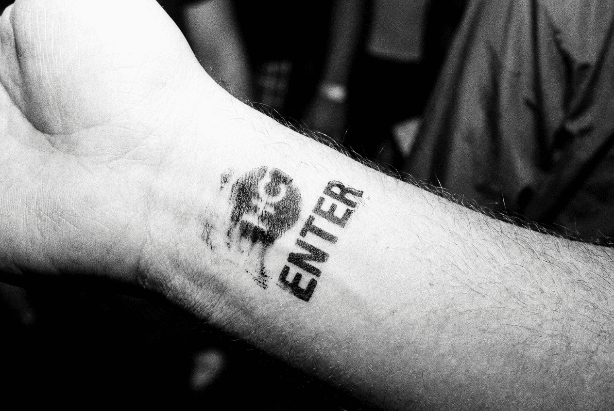 Silhouettes of people in a dimly lit space, creating an eerie and mysterious atmosphere.