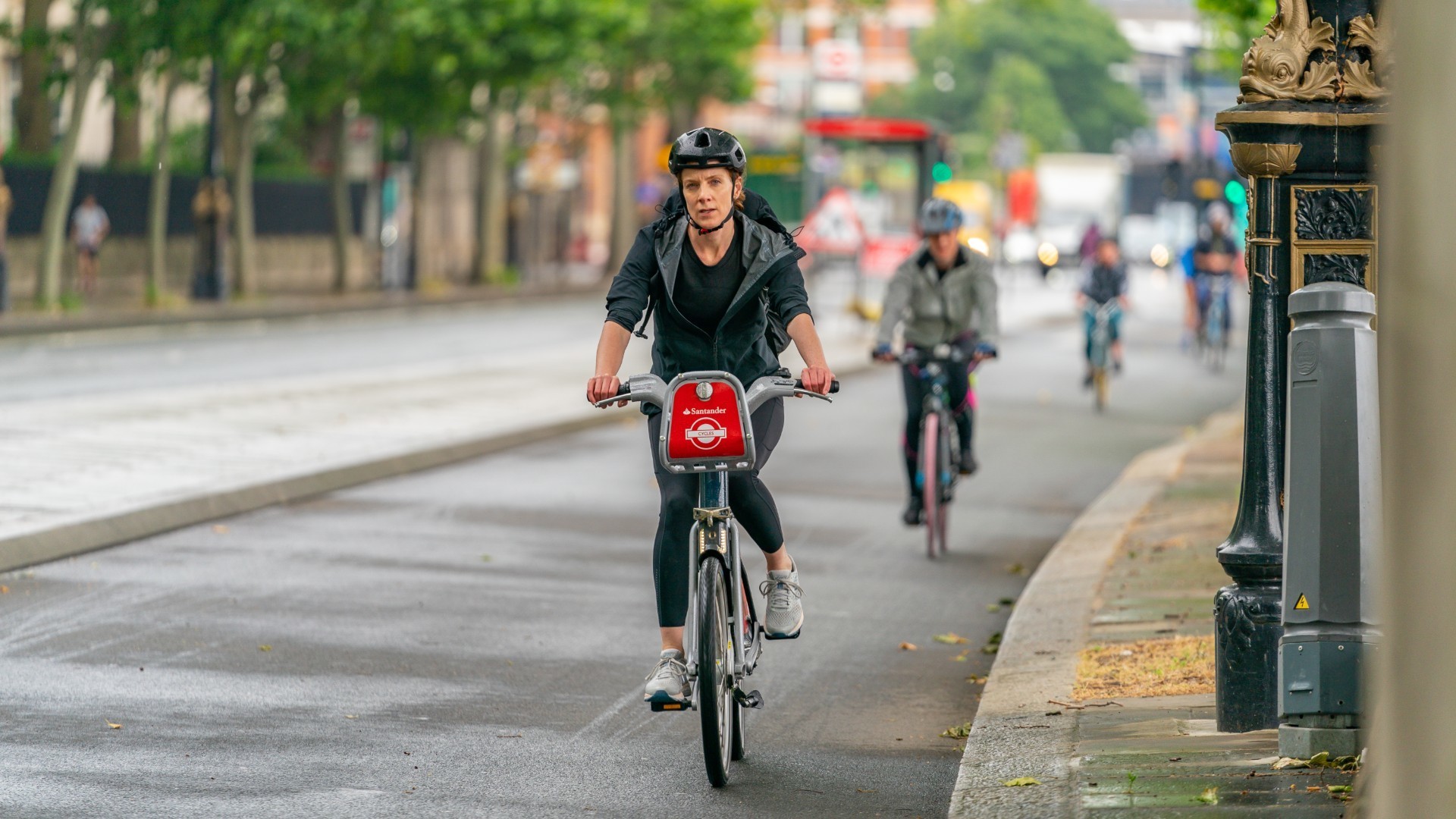 Woman riding a Santander Bike in London