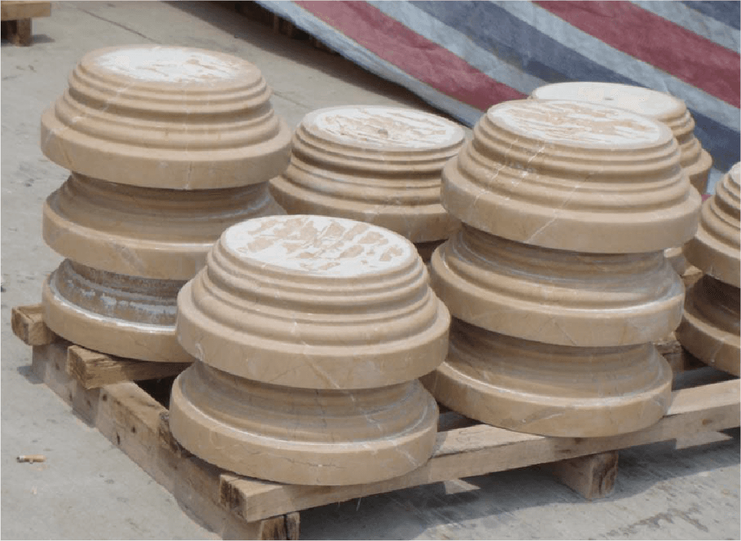 A batch of polished stone column bases ready for dispatch, demonstrating the efficiency and productivity of the Column Cap & Base Profiling Machine in high-volume production.