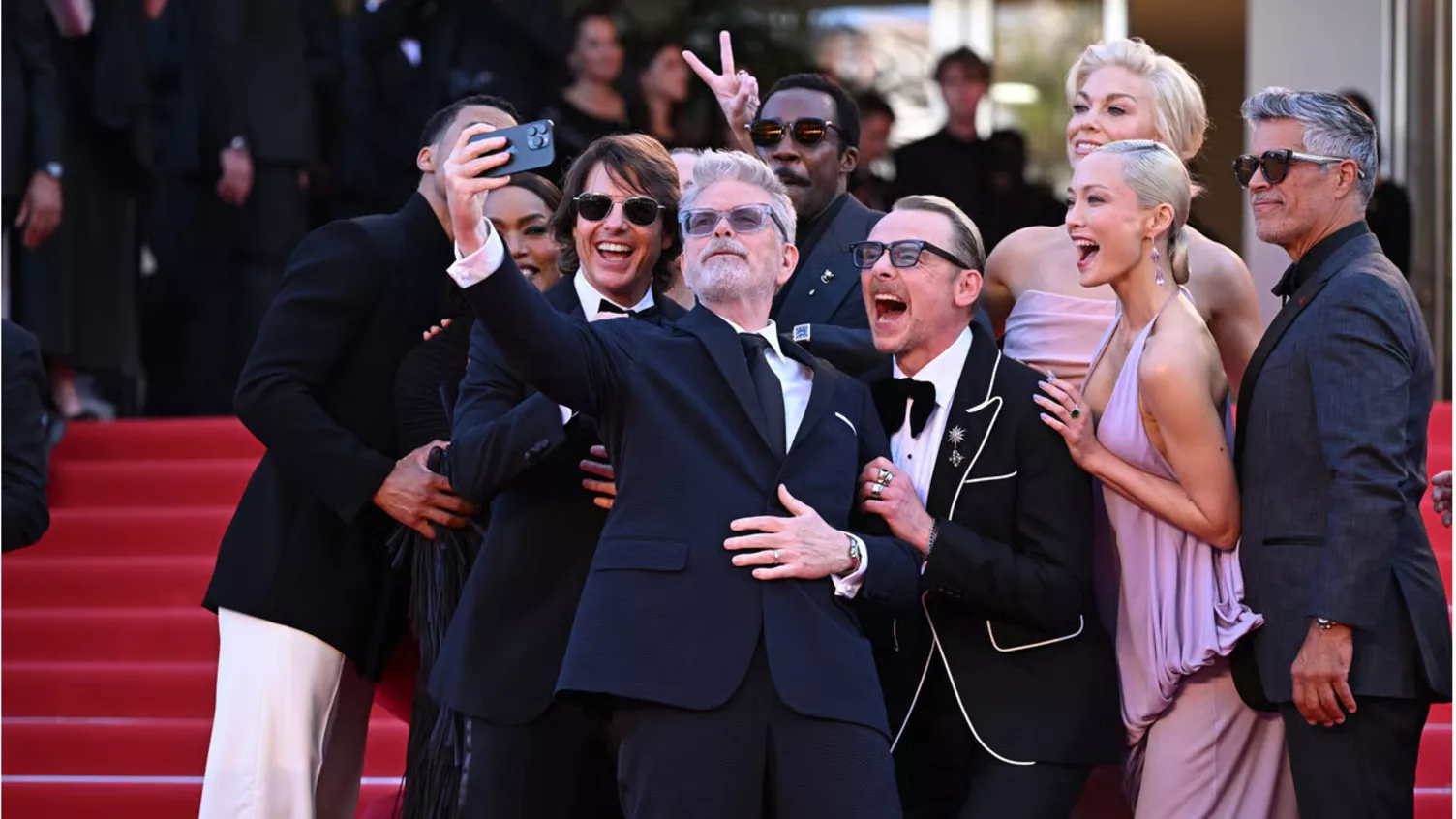 Celebrity interacting with fans at a public event