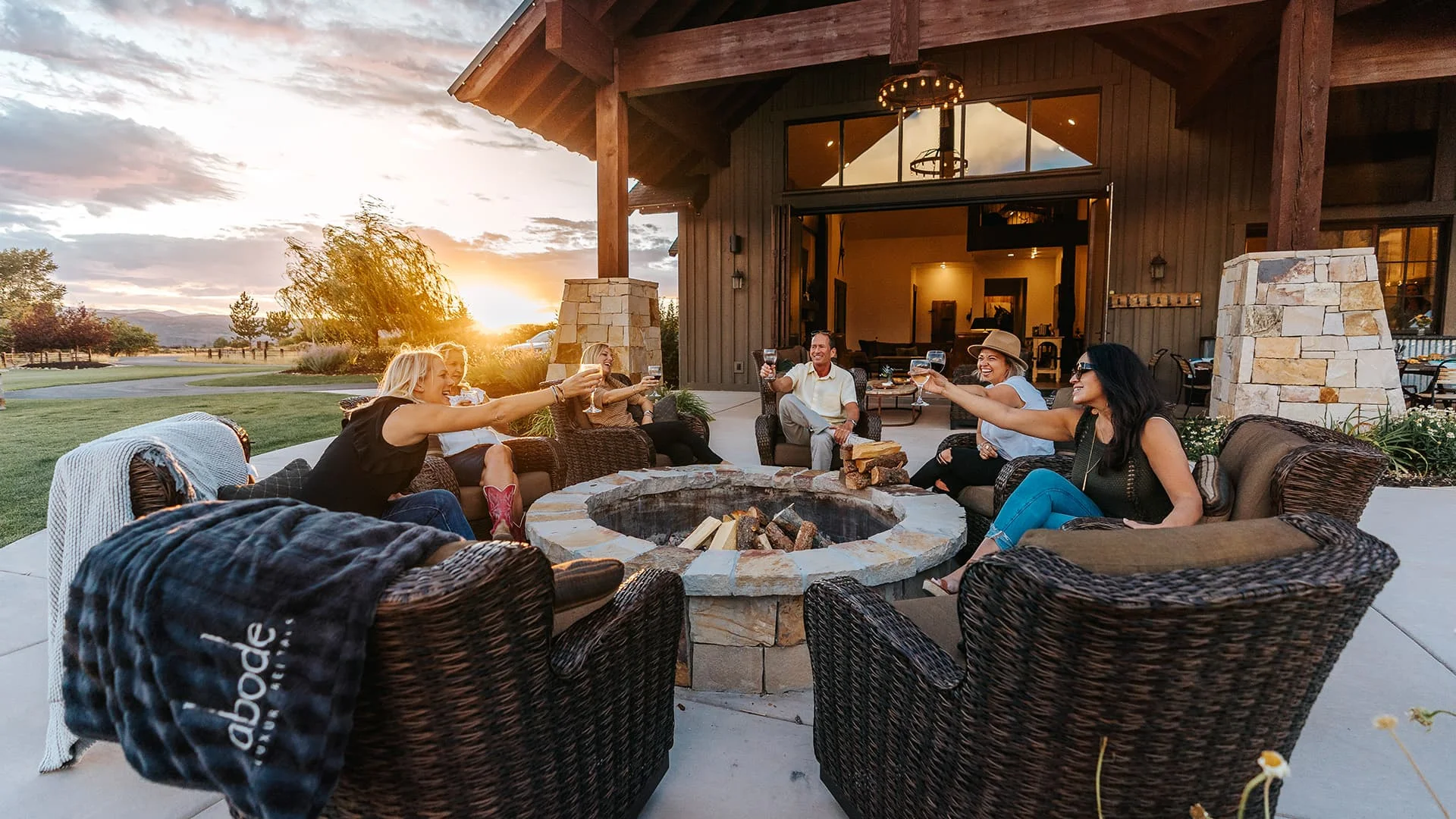 Group Gathered Around A Camp Fire