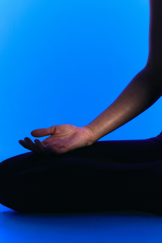 Two people stretching on yoga mats
