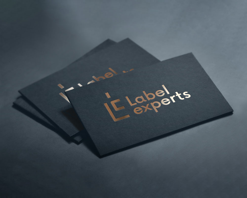 Business cards for Label Experts with a dark background and metallic printing