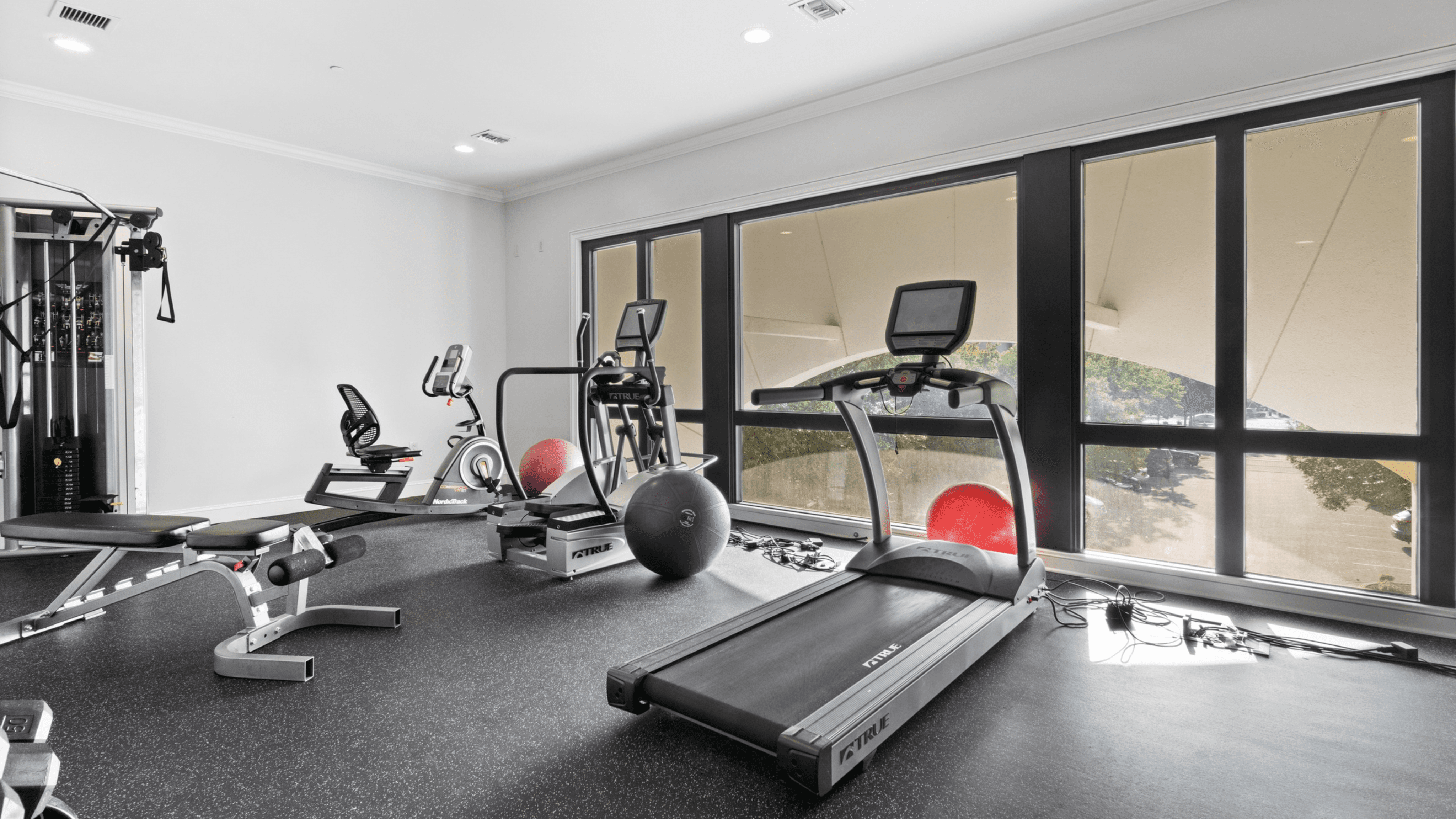 Modern 24/7 fitness center at The Gateway Village, offering a convenient and comfortable space for wellness and exercise.