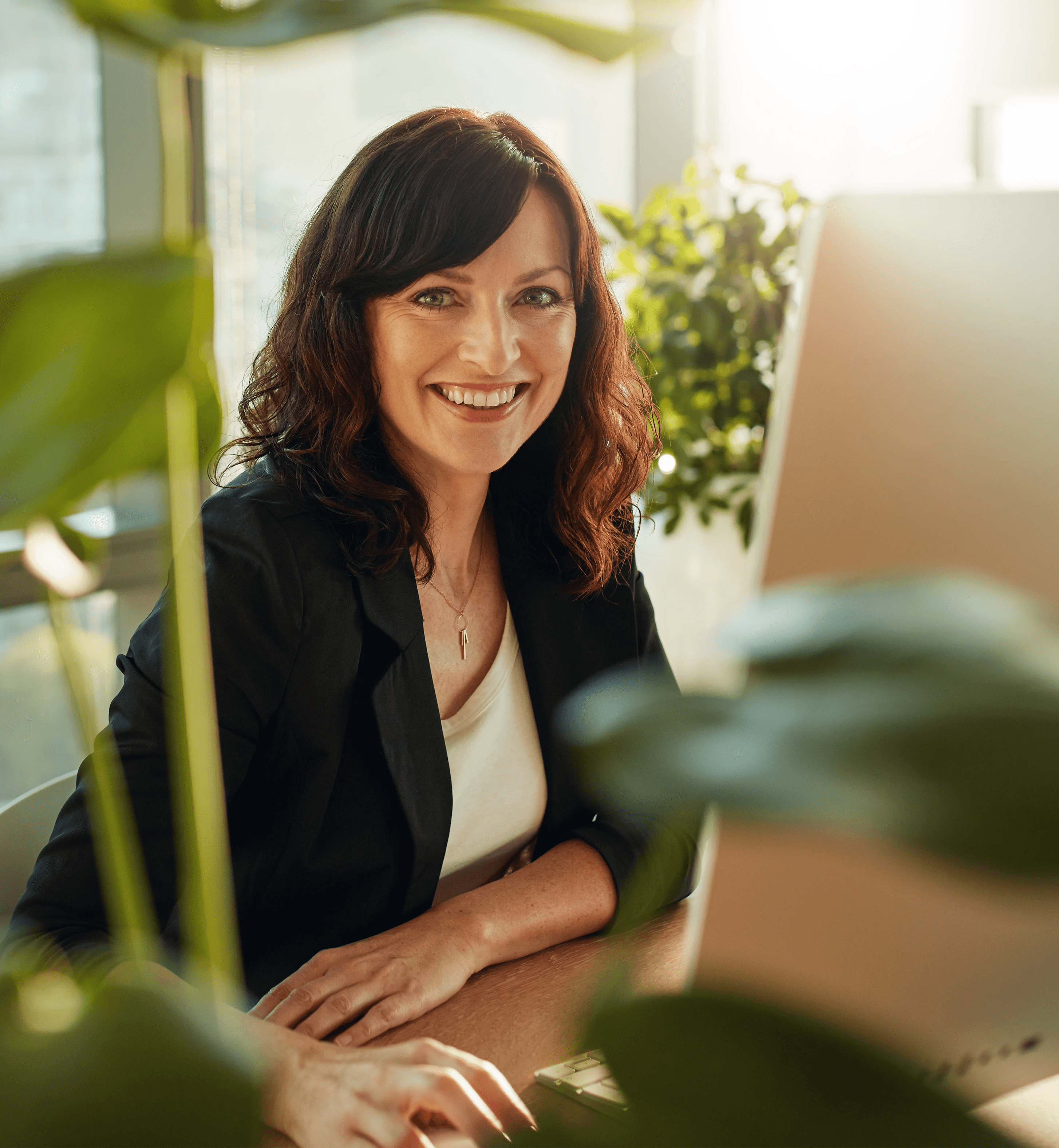 Woman working on laptop in her office