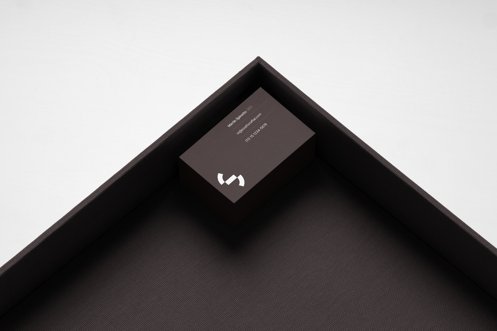 Business card laying in a high-end setting with a lot of negative spacing