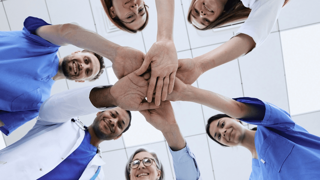 Two surgeons working in a hospital with the hands of a human heart