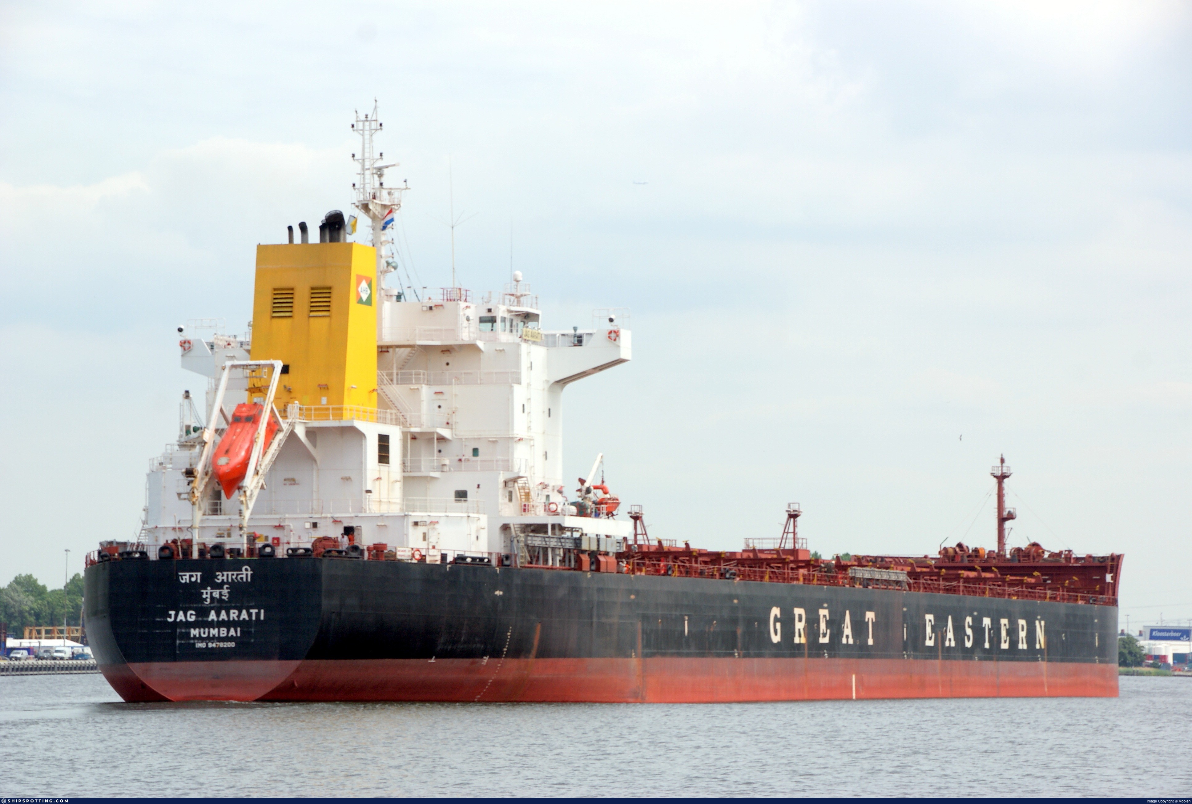 M/V JAG AARATI (IMO 9478200) bulk carrier alongside berth — aft view showing superstructure, hatch covers, and funnel markings of Great Eastern for Santos cargo hold cleaning project.