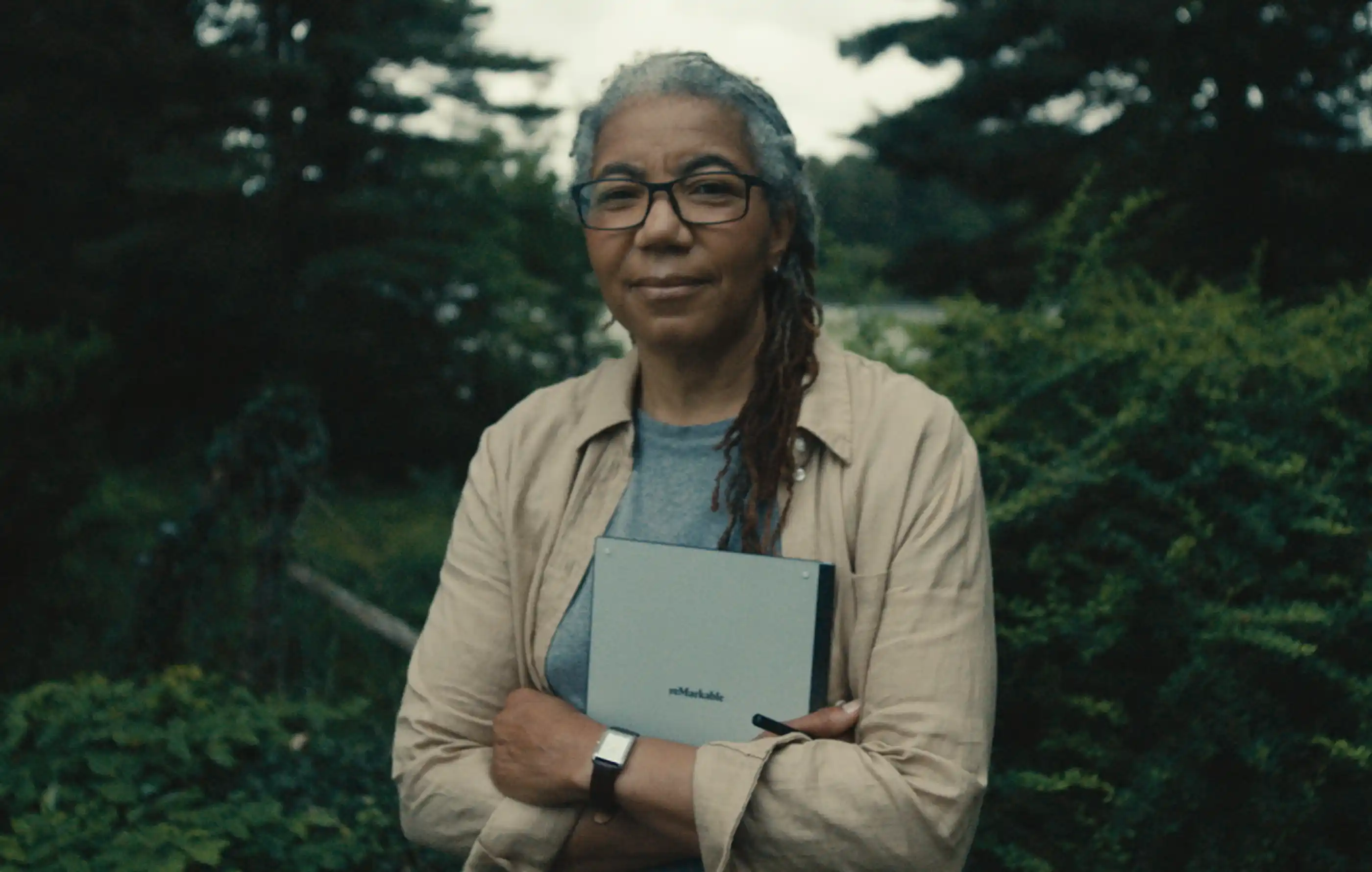 Professor Stephanie Dunson holding her reMarkable tablet outdoors