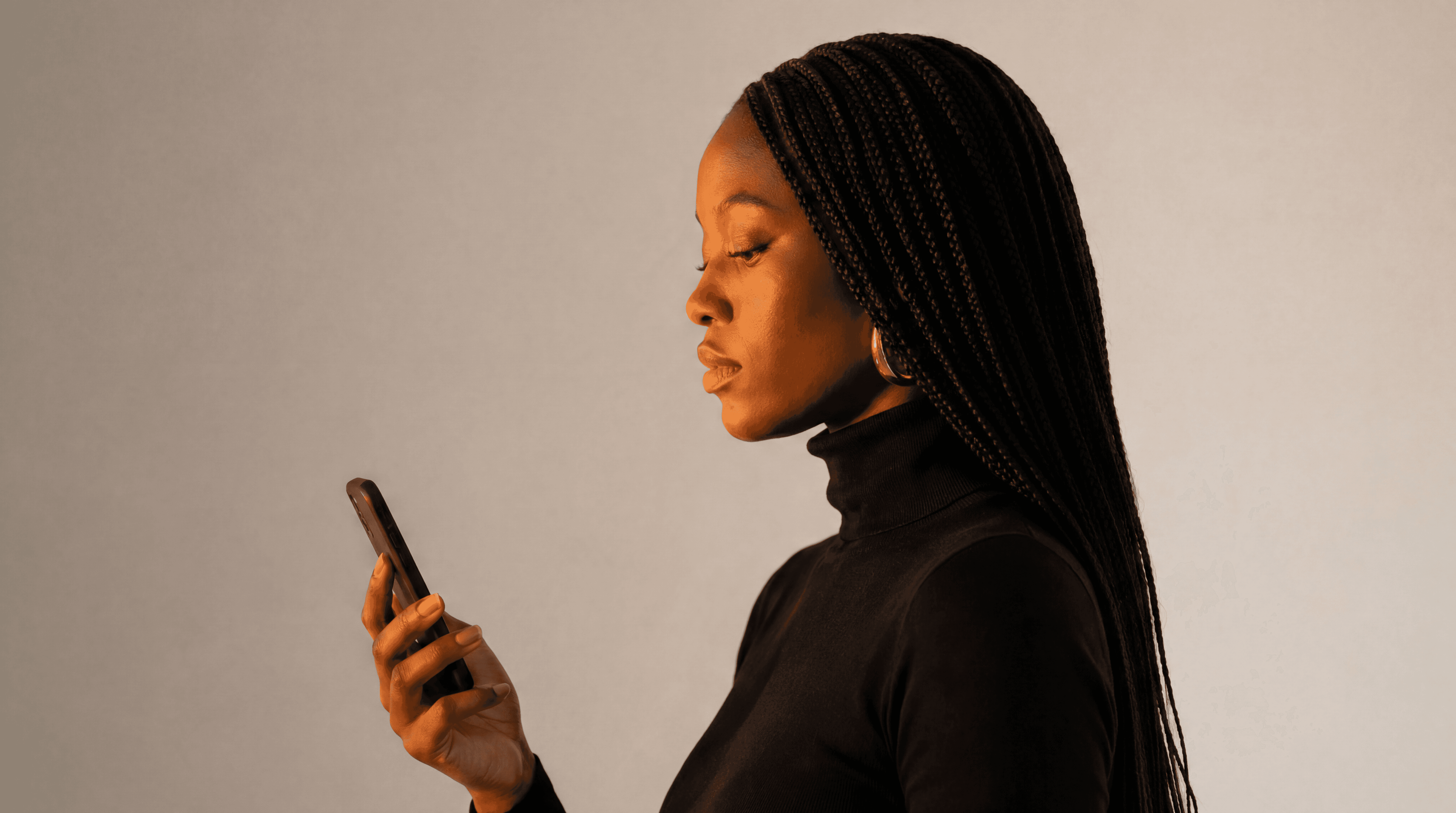 a woman looking at phone screen