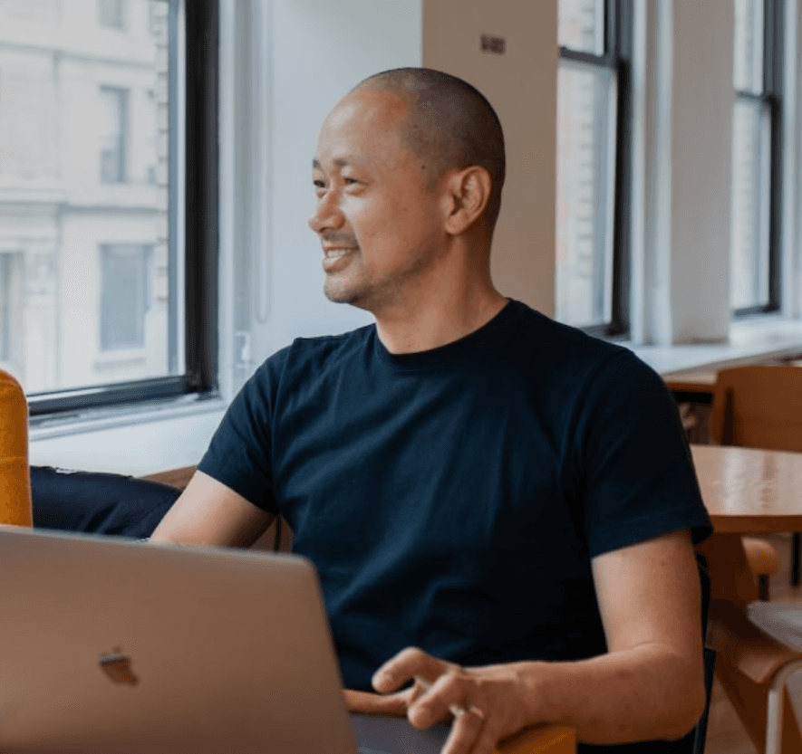 A small design team collaborating around a shared workspace, ideas in motion.