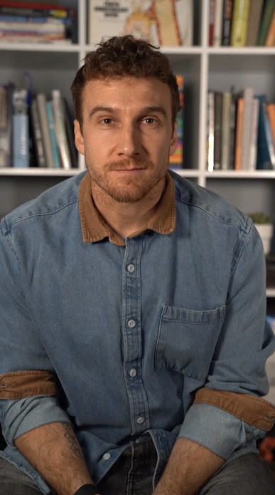 Man sitting in front of books