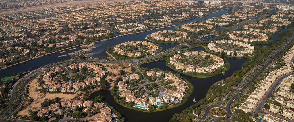 Jumeirah Islands view near Springs 11, showcasing lush greenery and serene water features in a residential area.