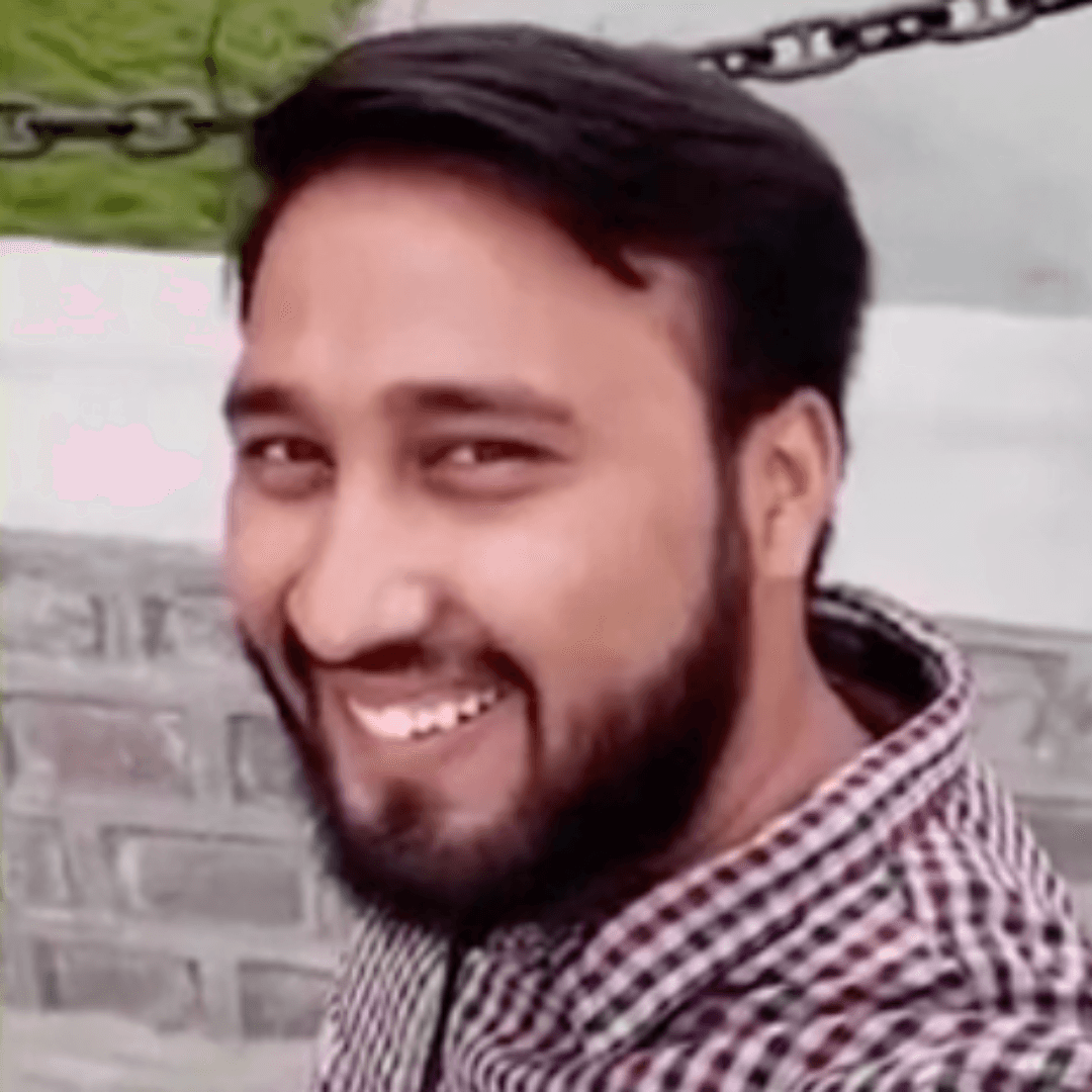 a person sitting at a table looking at the phone