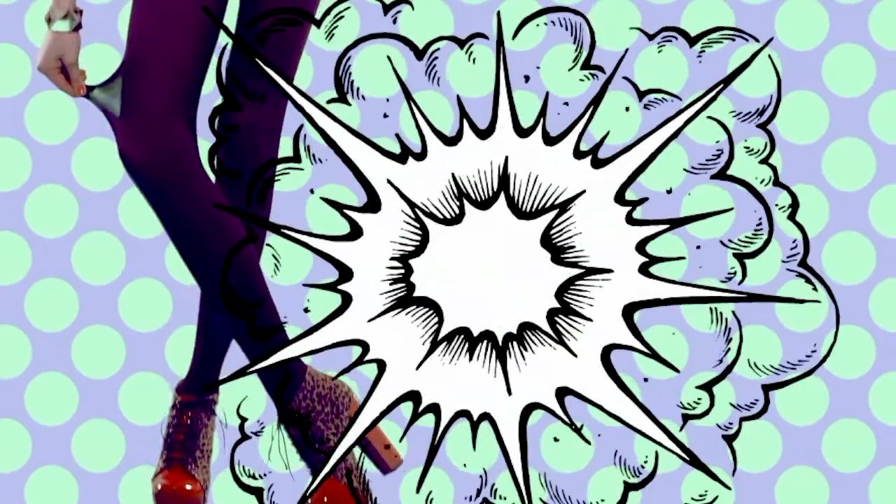 A close-up image of a stainless steel espresso machine's steam wand frothing milk in a metal pitcher, highlighting the process of making a creamy latte.