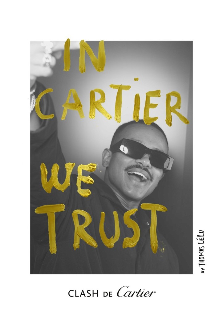A motivational poster features a black-and-white photo of a young man wearing sunglasses, smiling. The phrase 'IN CARTIER WE TRUST' is written in large yellow paintbrush letters across the image. The bottom of the poster includes text that reads 'CLA