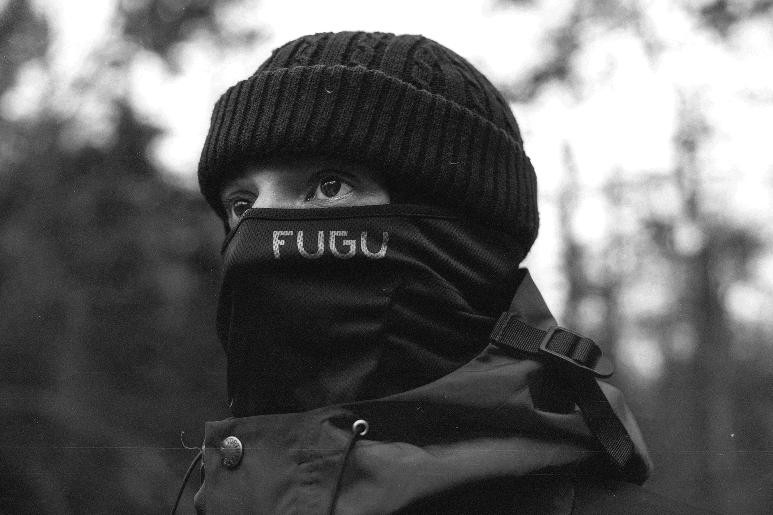 Person wearing a branded Fugu neck gaiter.