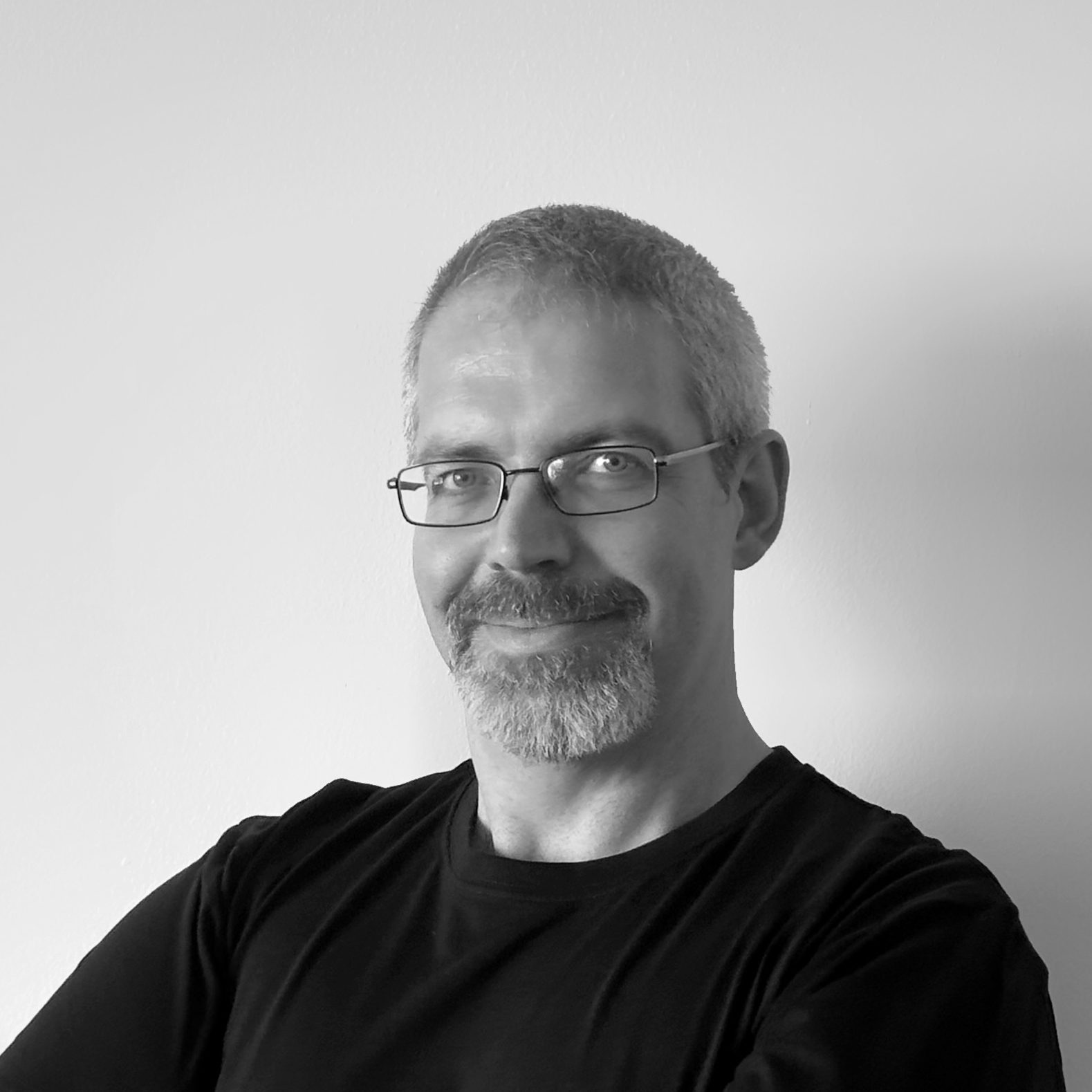 grayscale photography of man wearing crew-neck shirt