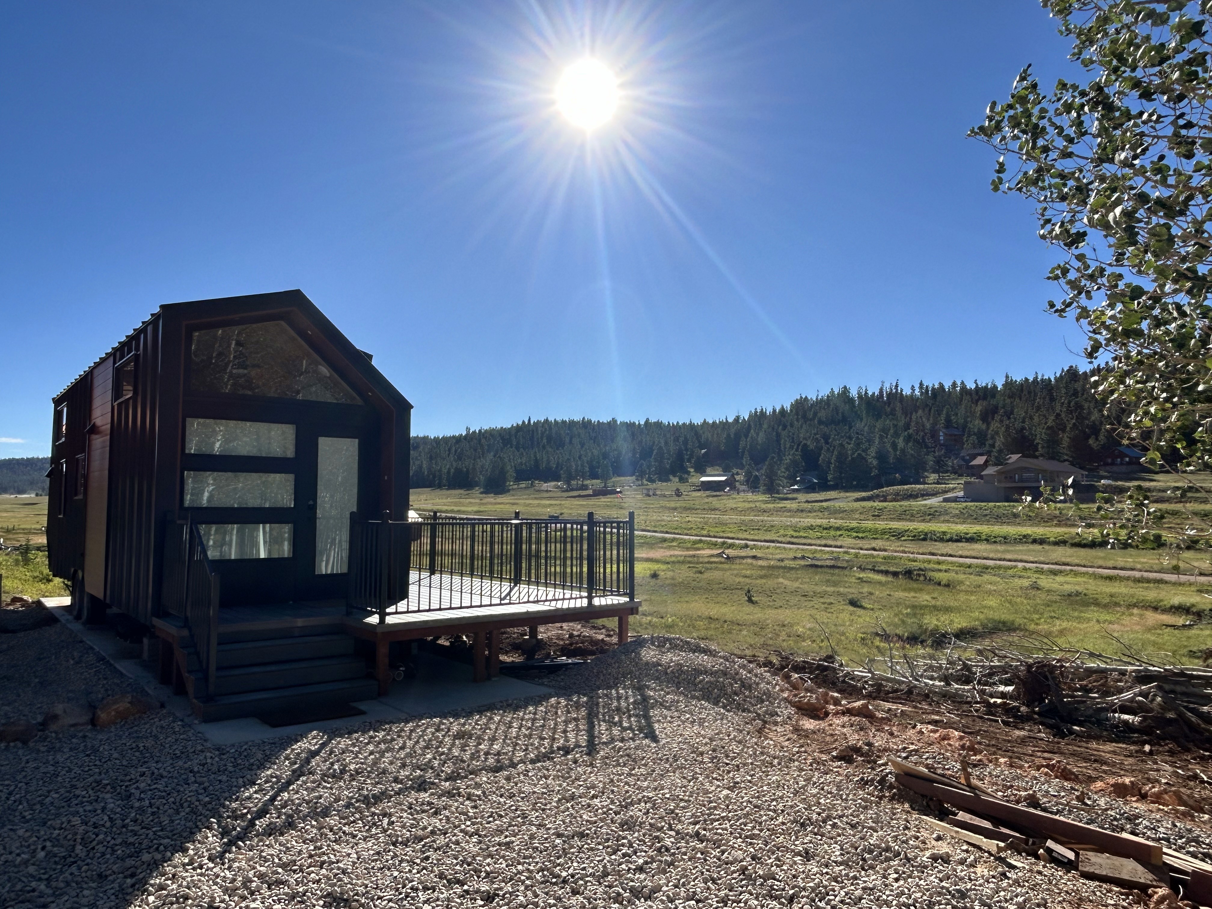 Retro-inspired living room with wood beams, accent wall, and detailed woodwork in a St. George, Utah remodel by Madsen Homes