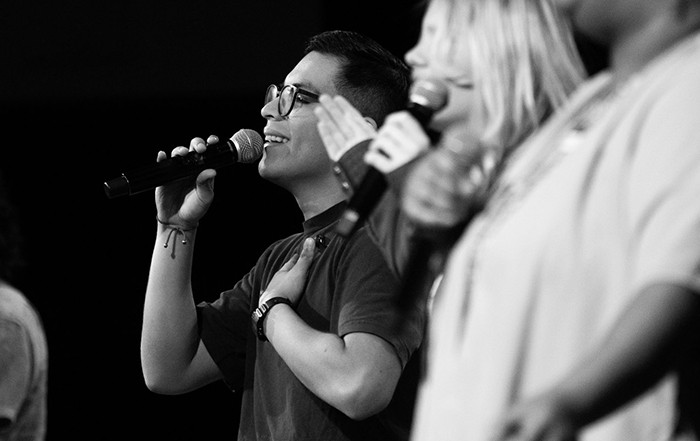 Band singing from the stage