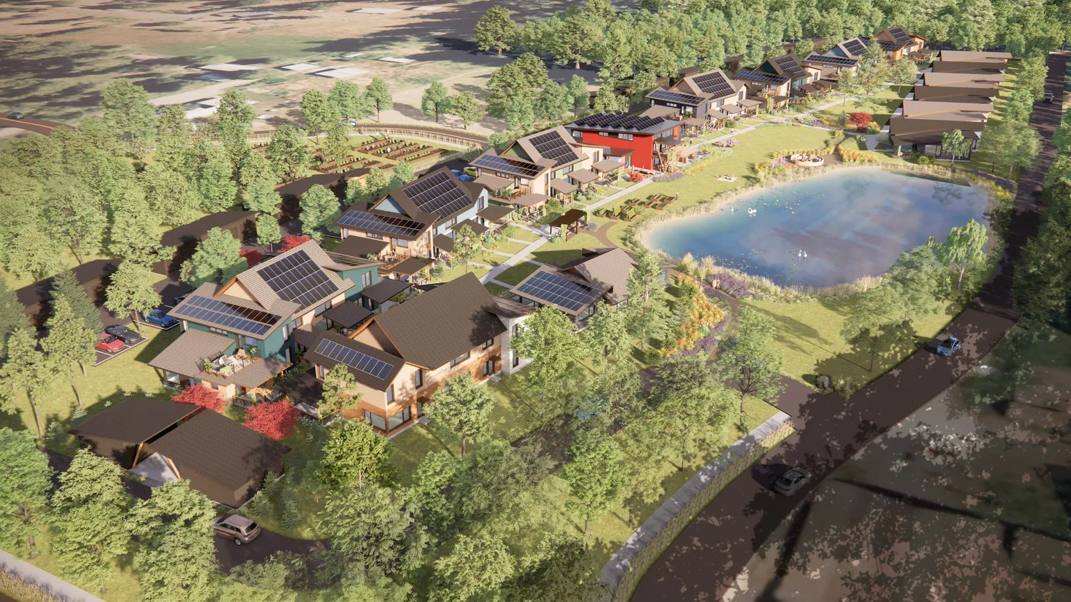 Aerial view of the planned Rooted Northwest cohousing village with homes, shared spaces, and surrounding green space.