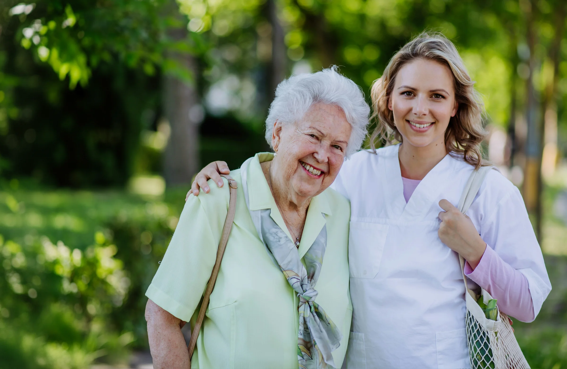 Community nurse and older client together outdoors in Brisbane