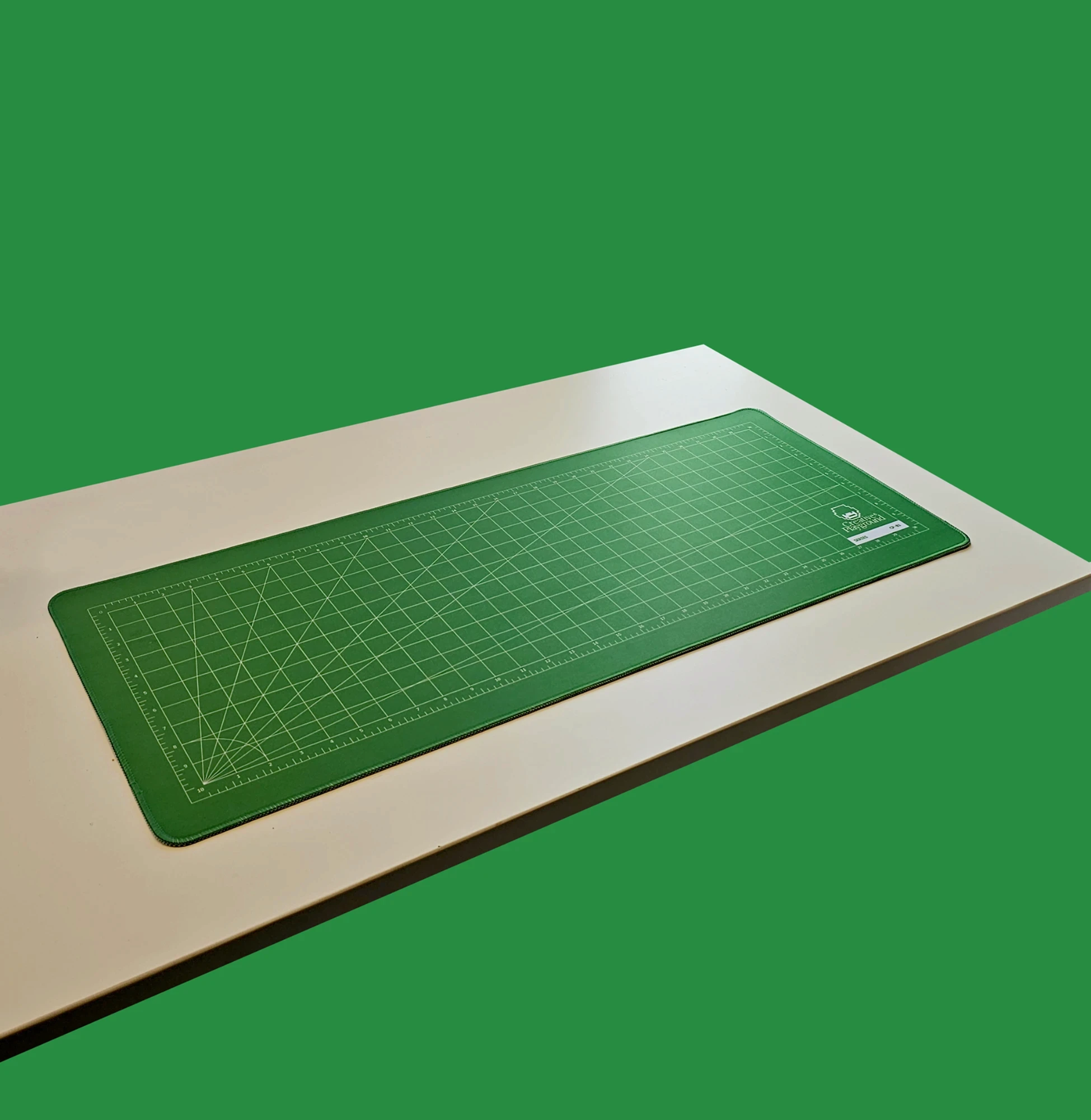 Cutting Mat Green on a white desk against a green background