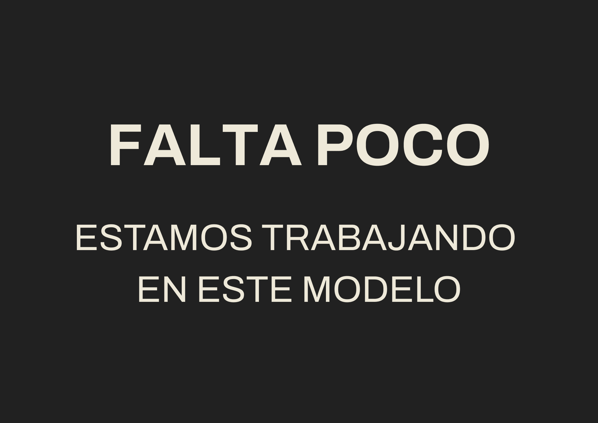 Laptop on a clean desk next to modern decor.