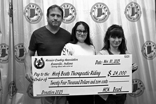 Hoof Beats Therapeutic accepting check from HCA